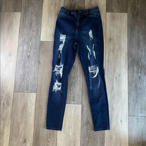 Distressed deep washed jeans